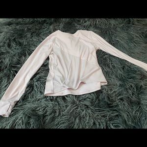 A light pink athletic shirt with cute stripes.